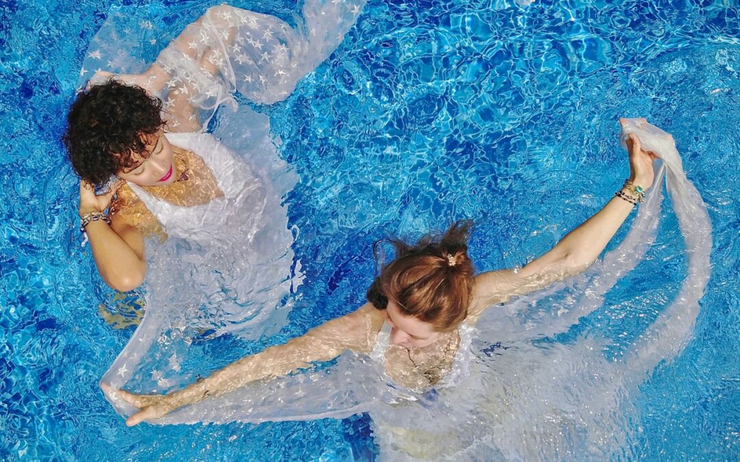 aerial view photography of two women on water during daytime